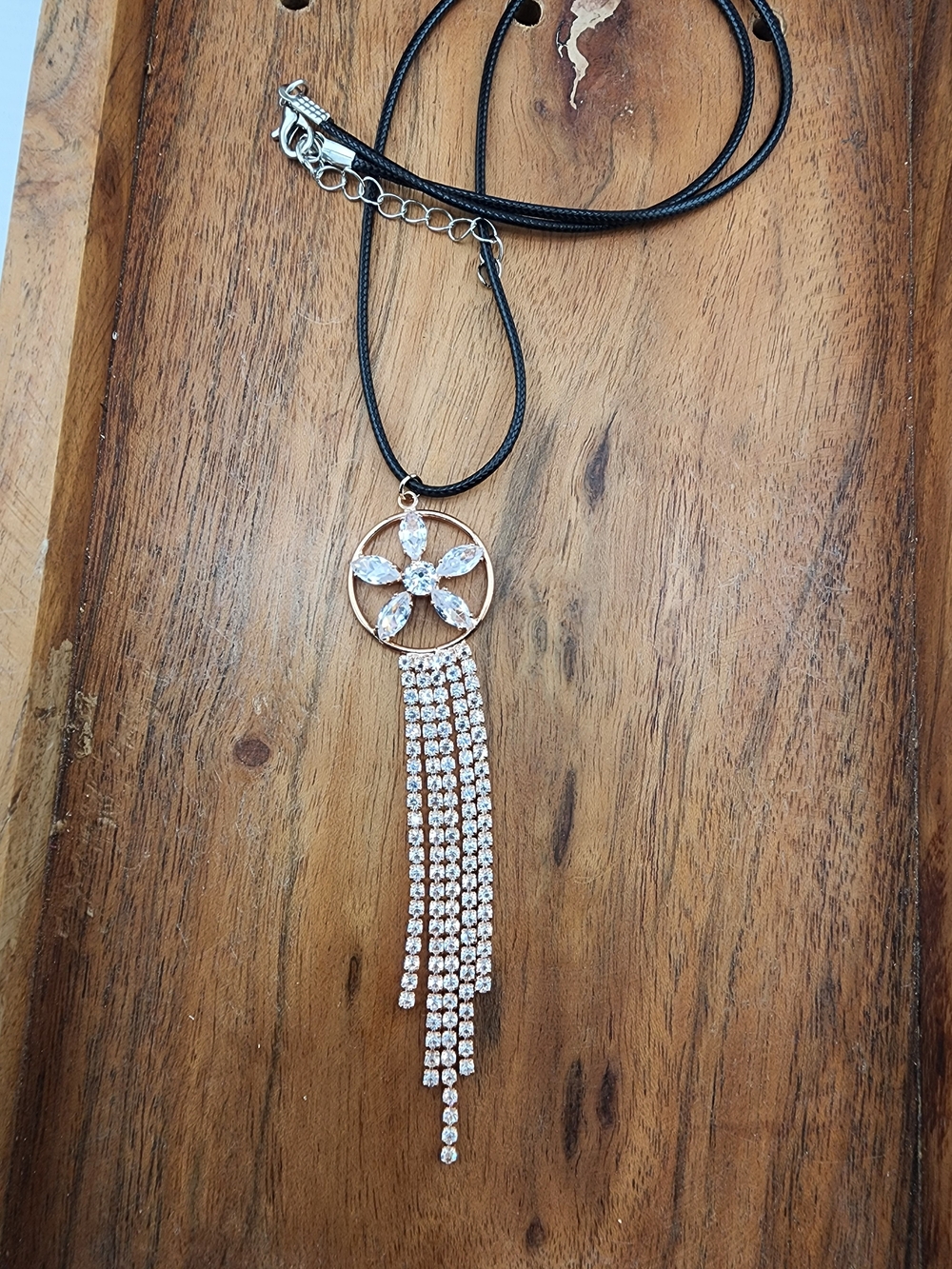 Gold Starburst Rhinestone Tassel Necklace on Black Cord